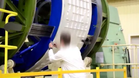 Reuters Russian video still - rocket engineer at work
