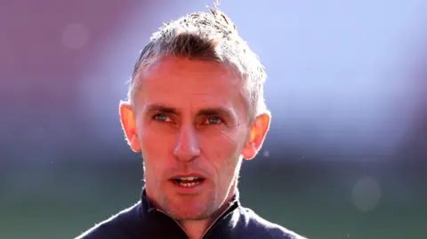 Getty Images Kieran McKenna head and shoulders picture, as he wears a zip-up top