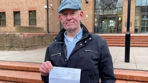 Garry Kay standing outside Derby Combined Court Centre