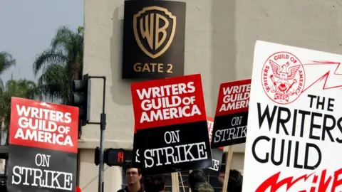 Reuters People basal   with signs during Hollywood writer   strikes 