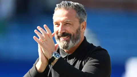 Derek McInnes claps his hands