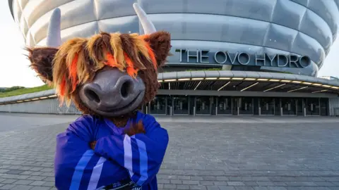 Ryan Fleming Clangus - an anthropomorphic moose wearing an ice hockey jersey, standing outside the OVO Hydro arena
