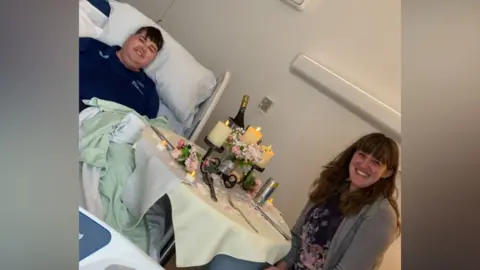 Ashgate Hospice Jack Timmins a patient at Ashgate Hospice, in Chesterfield, with his wife Rachel at a table with candles, a bucket of drinks and flowers for a romantic dinner.