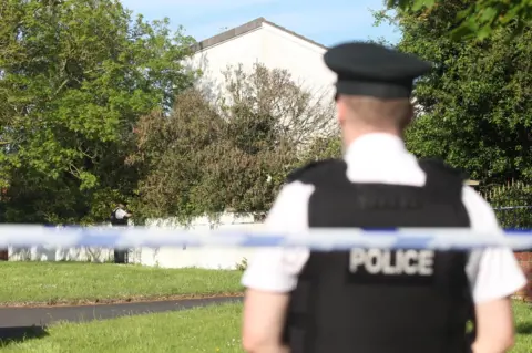 Pacemaker A police cordon at the couple's home at Upper Ramone Park
