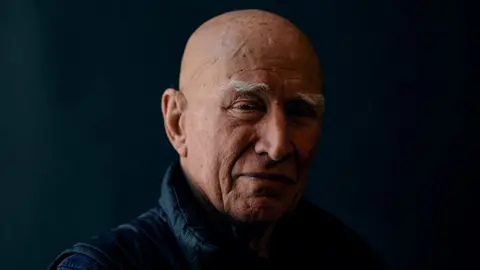 Brazilian photographer Sebastiao Salgado poses for a portrait at Somerset House, in London, on April 18, 2024.