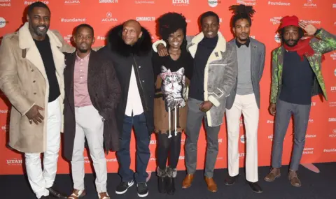 Getty Images Idris with some of the Yardie cast