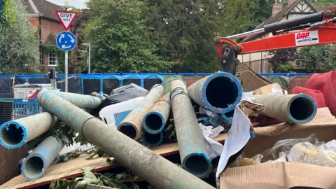 Julia Gregory/BBC Parts of a pipe are piled up