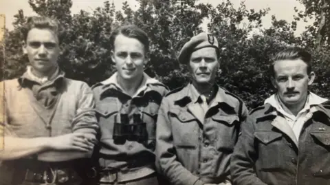 Joanna Burri-Weaver Black and white image of SAS hero behind enemy lines, Major Peter Weaver, third from the left wearing a beret.