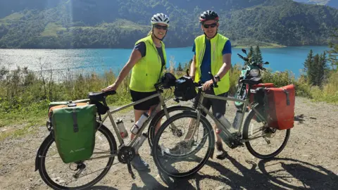 Richard and Ange Bebbington stood with their bikes during their Rome 2 Home challenge