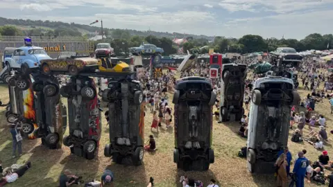 Carhenge, which is a sculptural artwork made of 24 vintage cars stood upright on their bonnets.