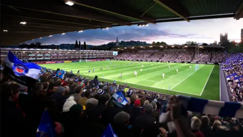 An artist's impression of the proposed Bath Rugby stadium showing players on a floodlit pitch and fans waving flags in the stand