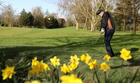 PA Media A golfer putts a ball