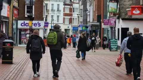 People walking through Wrexham city centre