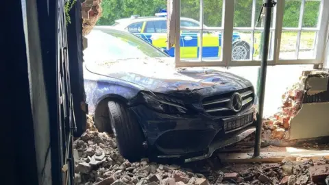 Sheena Parsons The blue Mercedes car, crashed into the Bell Inn in Kennett, Newmarket