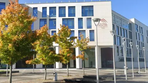 Google Image shows exterior of Merthyr Tydfil, a modern white building with blue windows