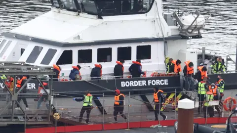 Reuters Migrants arriving at Dover on 23 April