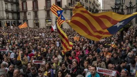 Getty Images Demonstrators gather in front of the Catalan Government building