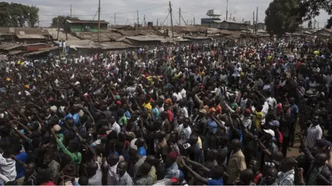 Getty Images Crowds of supporters listen to Raila Odinga