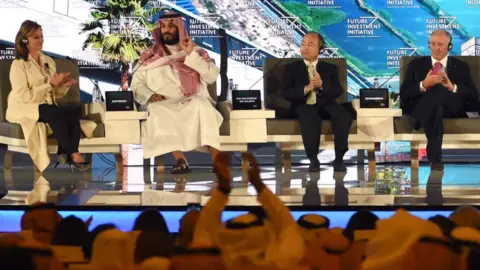 AFP Saudi Crown Prince Mohammed bin Salman (2ND L), US journalist Maria Bartiromo (L), Masayoshi Son (3RD L), the Chief Executive Officer of SoftBank and Stephen Shwarzman, CEO of the Blackstone Group, attend the Future Investment Initiative (FII) conference in Riyadh, on 24 October 2017