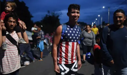 AFP/Getty Images A young Honduran migrant wearing an American flag t-shirt