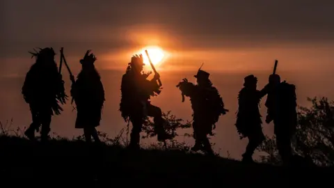 PA The Thieving Magpie Morris Side (Morris Dancers) during their "Dance in the Dawn" to mark May Day in Yorkshire, England