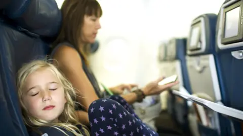 A child with parent on a plane