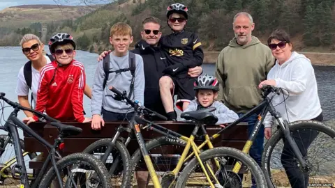 Damien Gaunt Damien Gaunt, second from right, with his children, partner and his friend's family