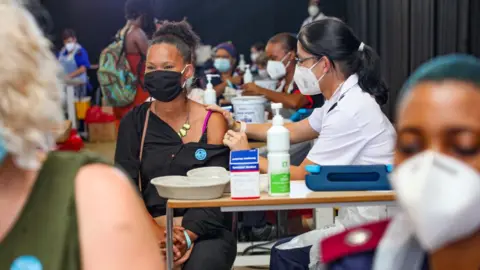 Getty Images Woman getting vaccinated