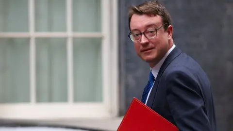 Sir Simon Clark arrives at Downing Street