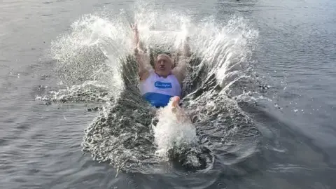 Sue Ryder Stuart Golledge jumping into water