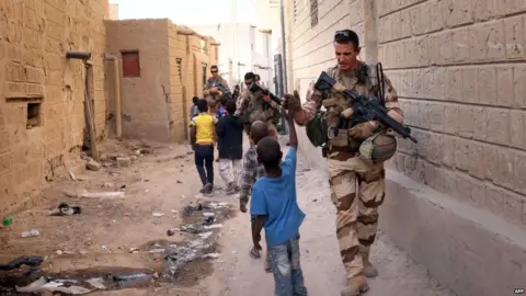 AFP French soldiers of the Barkhane force patrol the streets of Timbuktu, northern Mali, on 5 December 2021.