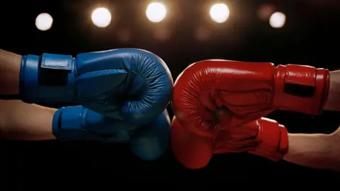 Getty Images Boxers touch boxing gloves 