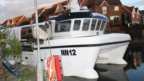 NCA A white boat. 