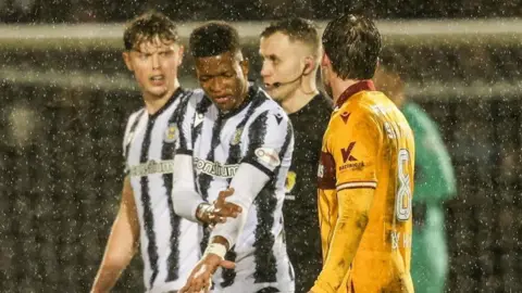 Motherwell's Callum Slattery (R) remonstrates with St Mirren's Richard King (L) after he is shown a red card during a William Hill Premiership match between St Mirren and Motherwell at the SMiSA Stadium, on February 21, 2026, in Paisley, Scotland. 