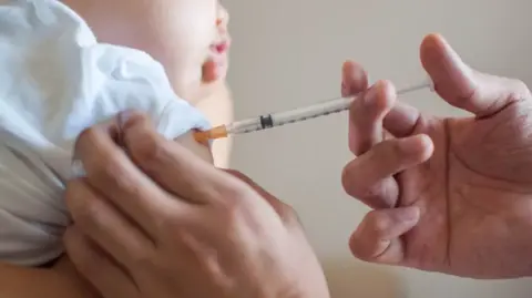 Getty Images Baby having an injection