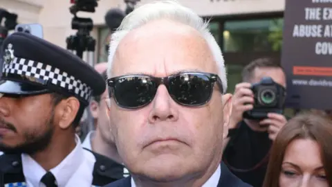 Getty Images Huw Edwards, wearing sunglasses, extracurricular  tribunal  during his archetypal  quality  successful  July