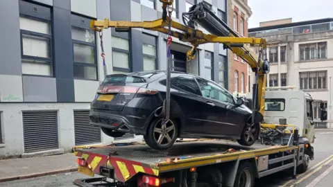 Transport Nottingham A car being towed 