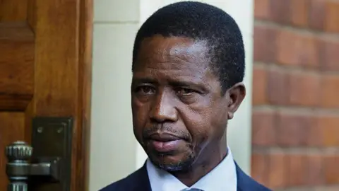 Former Edgar Chagwa Lungu, in a dark suit and light shirt