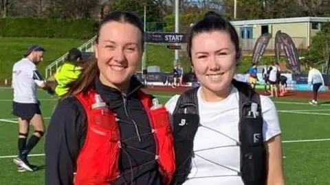 Picture of Catrin and her friend participating in a marathon