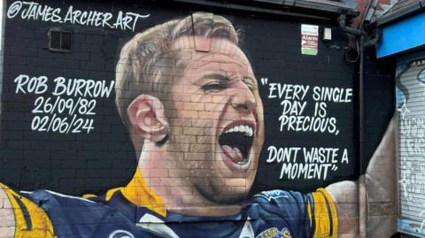 A mural showing Rob Burrow playing for Leeds Rhinos