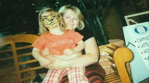 Supplied Maddy Wood as a child with her mother Clare