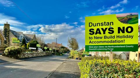 "Dunstan says no" signs have been placed in gardens throughout the village