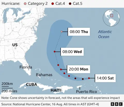 This map shows the predicted path of Hurricane Erin, marked by red dots indicating forecasted positions and times. The hurricane is expected to pass near to Puerto Rico on Sunday then move northwest. It will be near the Bahamas by 20:00 AST on Monday before heading northeast across the Atlantic Ocean.