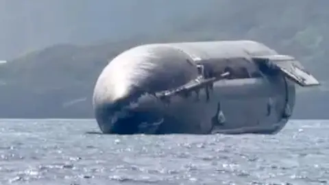 SpaceX rocket floating on the ocean
