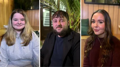 Close up of Lily who is smiling and has blonde/brown hair and is wearing grey hoodie. Similar close up of Callum who has a brown hair and beard next to Evie with has long brown curly hair. They are all three sat indoors.