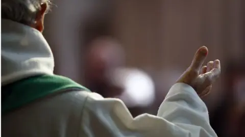 Getty Images Catholic priest