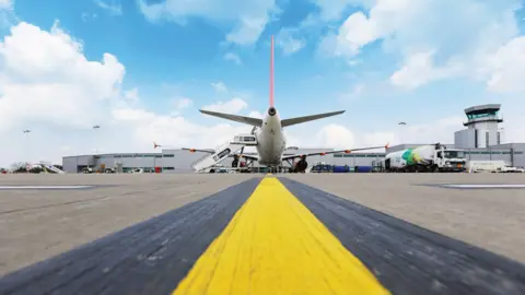 Getty Images A wide view of a runway at Bristol Airport with an Easyjet plane visible in the background