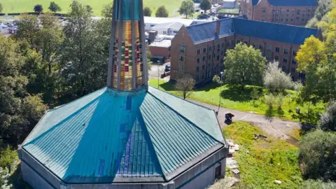 Historic England Aerial view of Hopwood Hall Chapel, Rochdale Road, Rochdale on a sunny day.