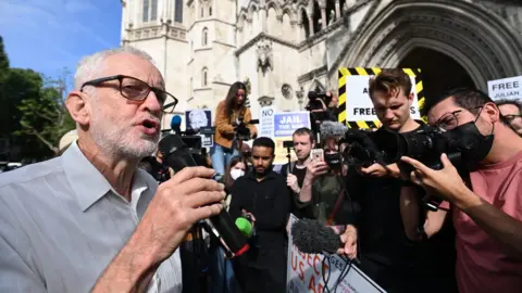 EPA Jeremy Corbyn speaks to the media outside the Royal Courts of Justice