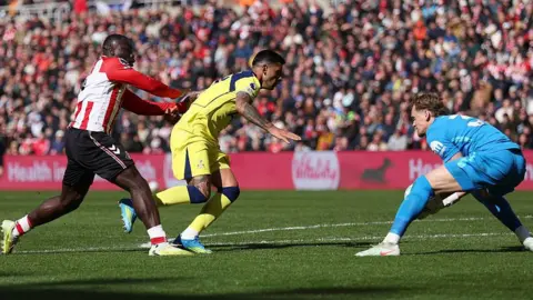 Brian Brobbey pushes Cristian Romero into Spurs team-mate Antonin Kinsky during the Premier League match between Sunderland and Tottenham Hotspur 